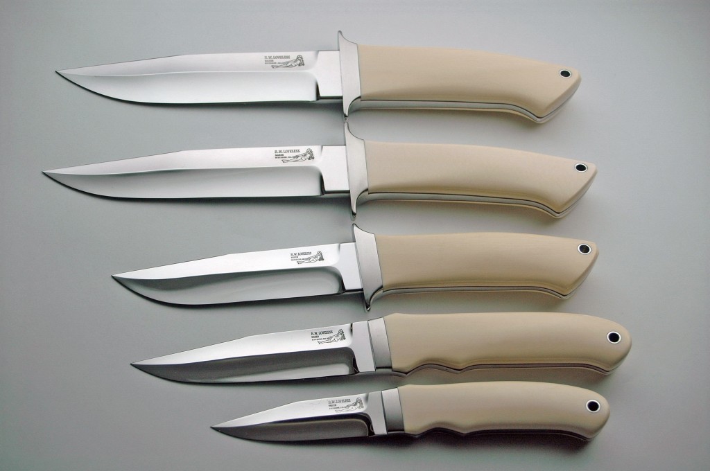 A row of five Bob Loveless drop point hunter knives with ivory handles